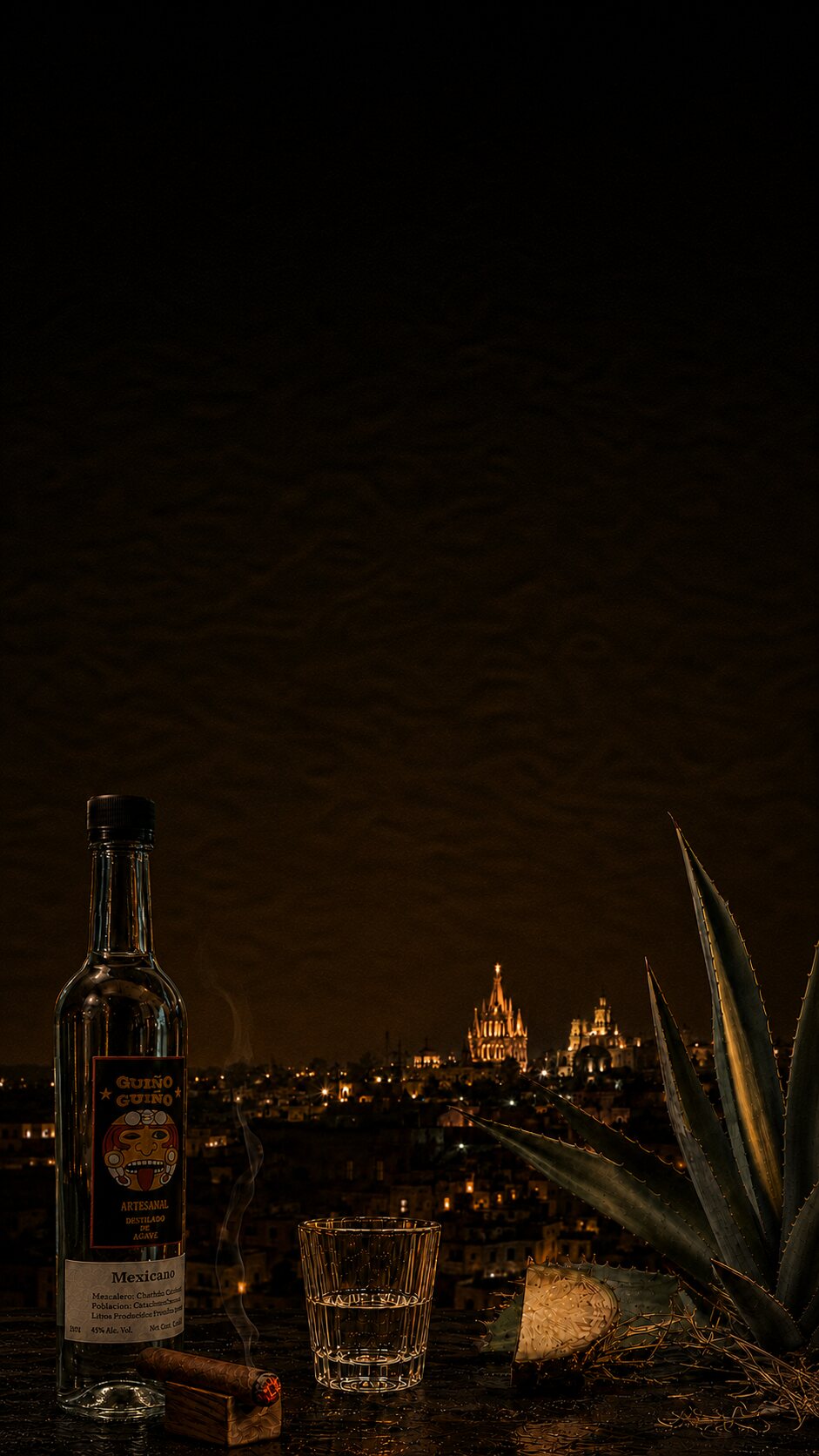 Guiño Guiño mezcal, a veladora, and agave overlooking San Miguel de Allende at night